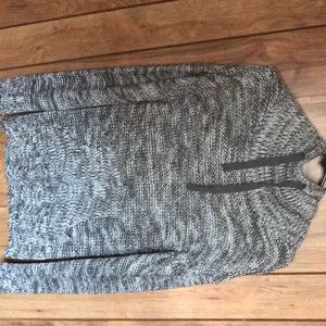 a grey sweater